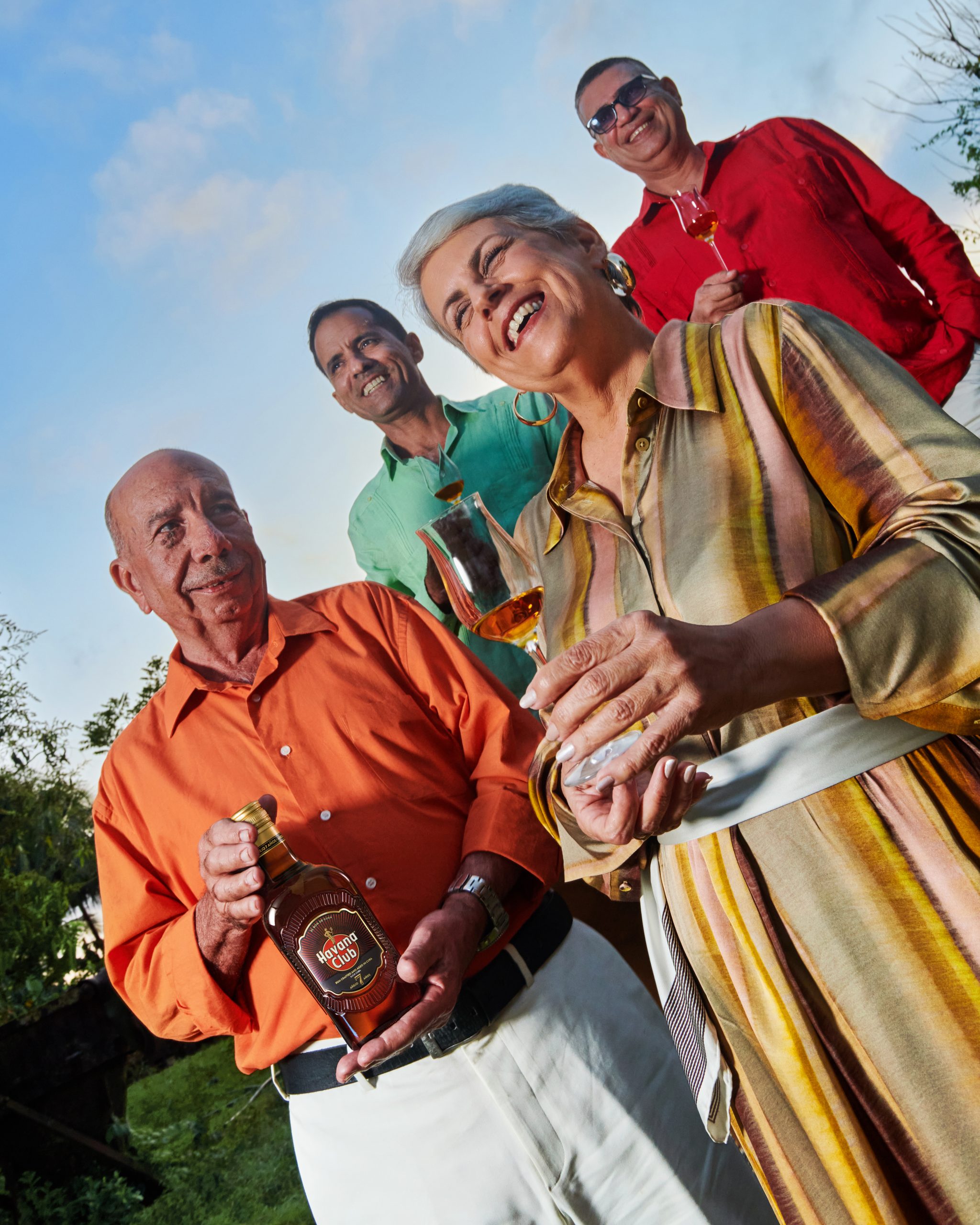 people smiling showing new havana club 7 bottle